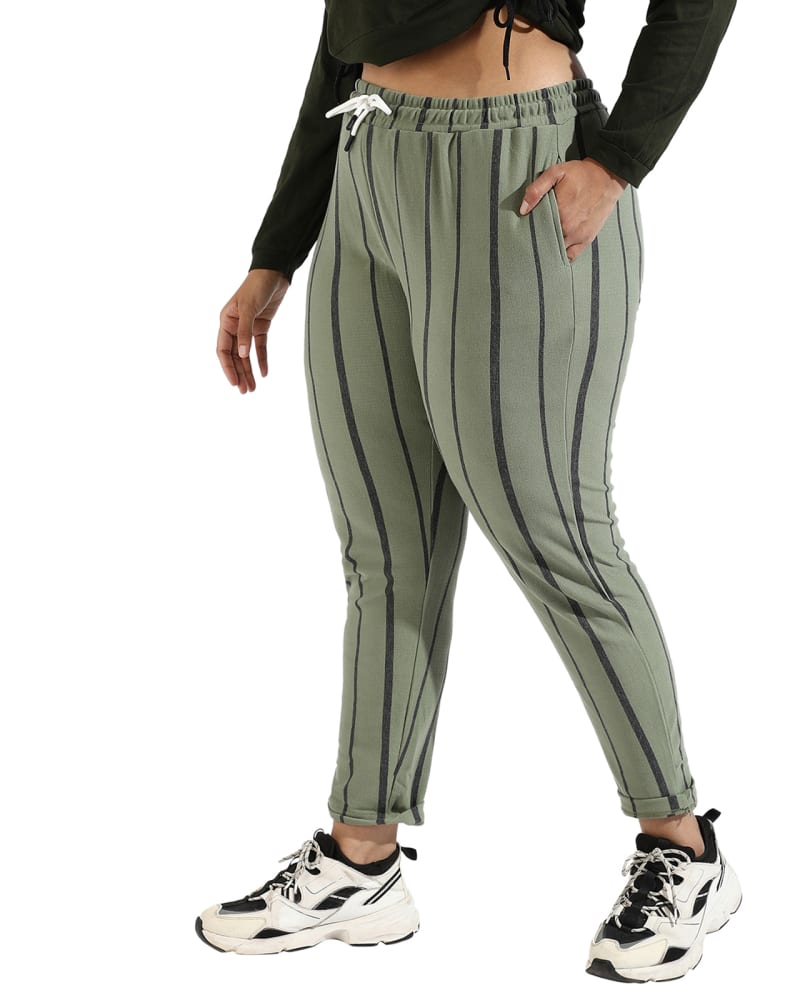 Side of a model wearing a size 5XL Women Olive Striped Active & Evening Trackpant in Sage Green by Instafab Plus. | dia_product_style_image_id:294252